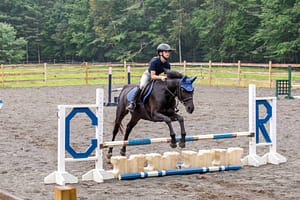 Camp Runoia equestrian horse rider jumping